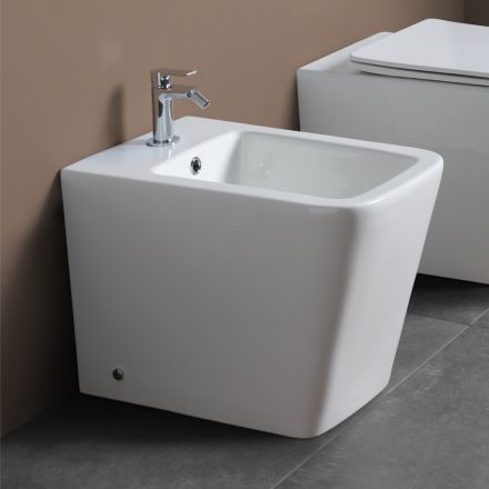Bidet jednootworowy montowany na podłodze, z białej ceramiki, o eleganckim, nowoczesnym wzornictwie – Giunco Viadurini
