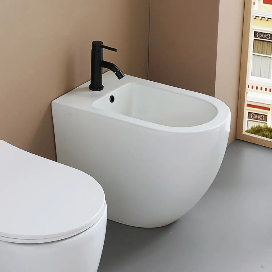 Bidet stojący z jednym otworem, wykonany z trwałej białej ceramiki o nowoczesnym wzornictwie - Olmo Viadurini