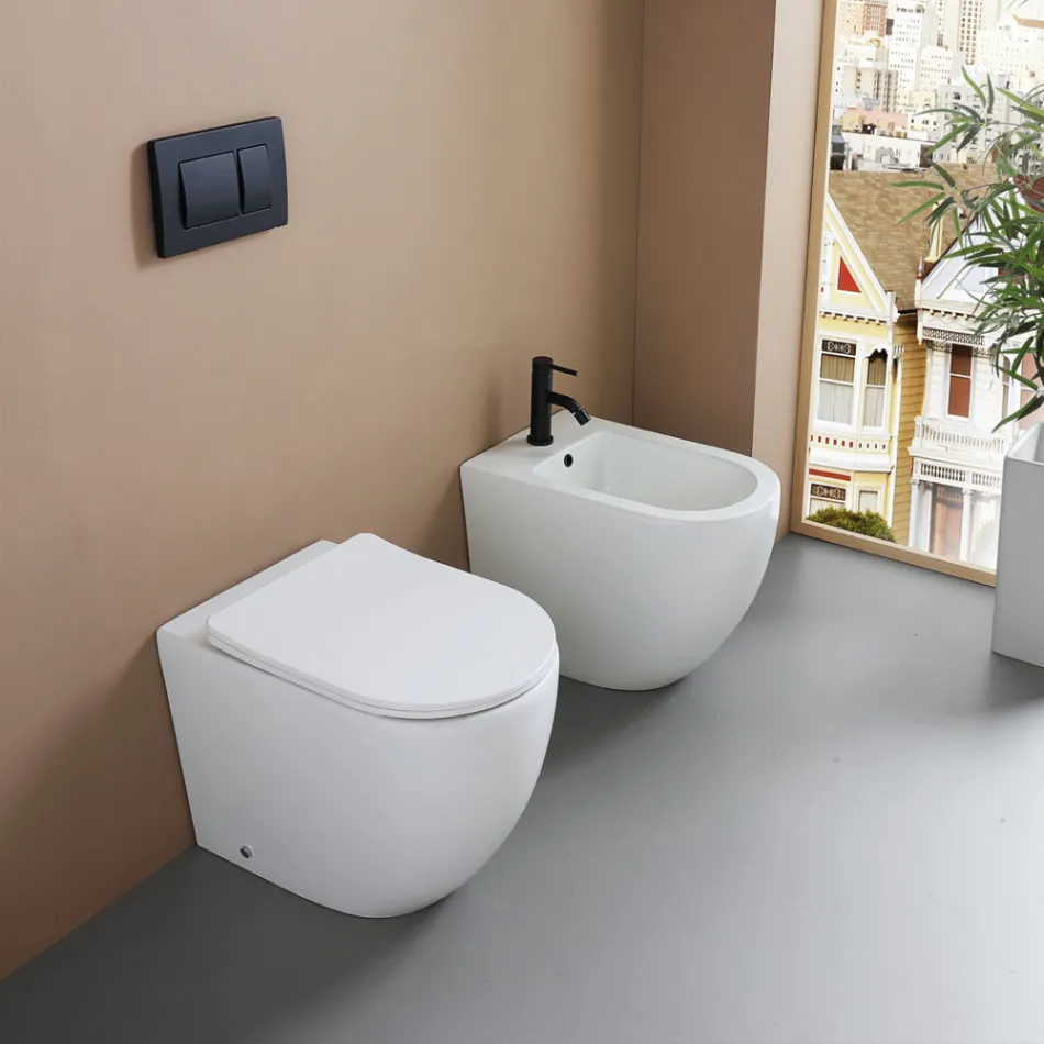Bidet stojący z jednym otworem, wykonany z trwałej białej ceramiki o nowoczesnym wzornictwie - Olmo Viadurini