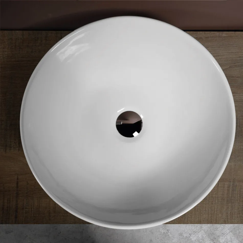 Owalna, pochylona ceramiczna umywalka nablatowa o nowoczesnym designie - Papavero Viadurini