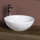 Owalna ceramiczna umywalka blatowa o nowoczesnym designie - Papavero Viadurini