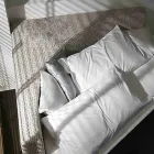 Nowoczesne okrągłe łóżko podwójne z kątowym zagłówkiem Made in Italy - Tima Viadurini