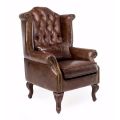 Fotel do wnętrz wykonany z postarzanej skóry w stylu vintage - stempel