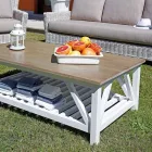 Salon na świeżym powietrzu ze stolikiem z drewna mango i poduszkami z polibawełny - Orlanda Viadurini