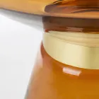 Stolik kawowy ze szkła i dekor ze stali platerowanej mosiądzem - Gabrio Viadurini