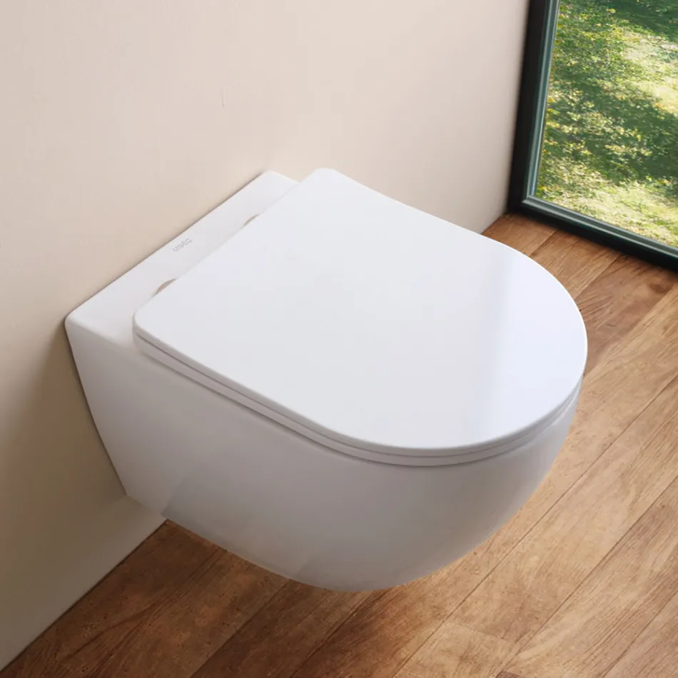 Podwieszana toaleta bezrantowa z wolnoopadającą ceramiczną deską sedesową – Juniper   Viadurini