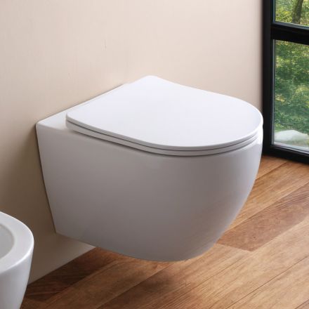 Podwieszana toaleta bezrantowa z wolnoopadającą ceramiczną deską sedesową – Juniper   Viadurini